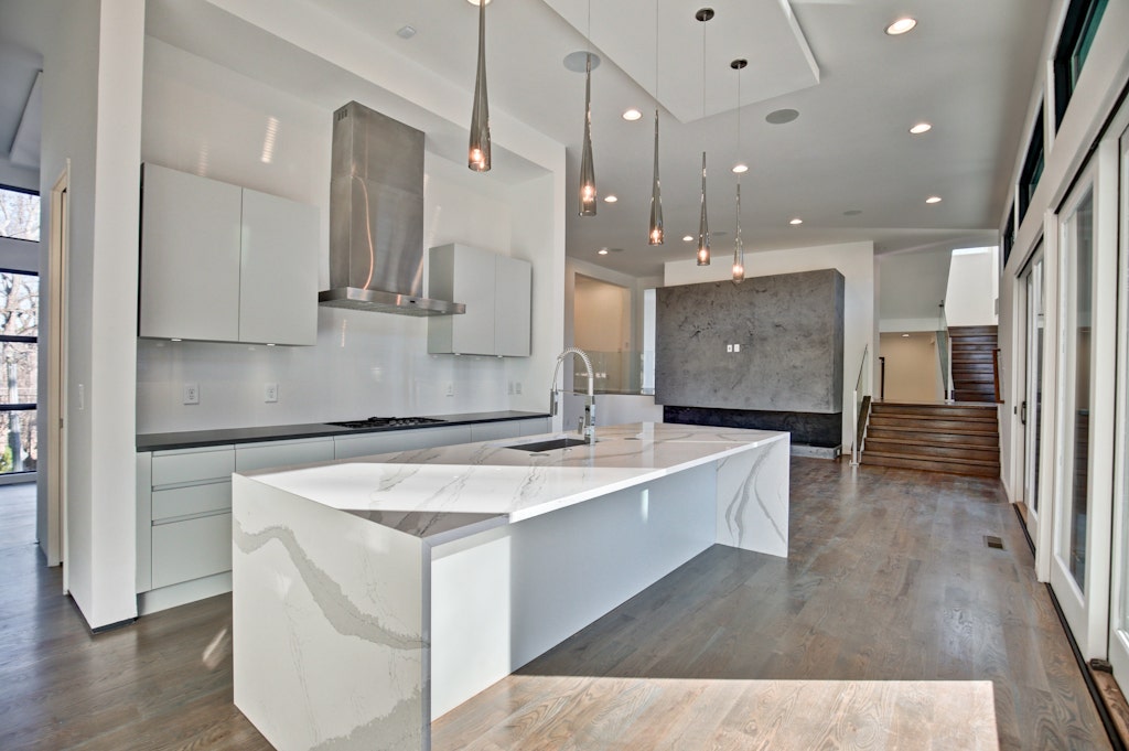 White Open Kitchen with Marble Island Countertop